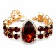 Aproce „Debesu Piliens II (Red Magma / Ruby)“ ar Swarovski® kristāliem